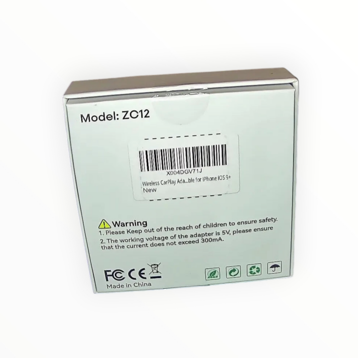 dealman Pemacom wireless CarPlay adapter box with model ZC12 label and barcode for iPhone connectivity